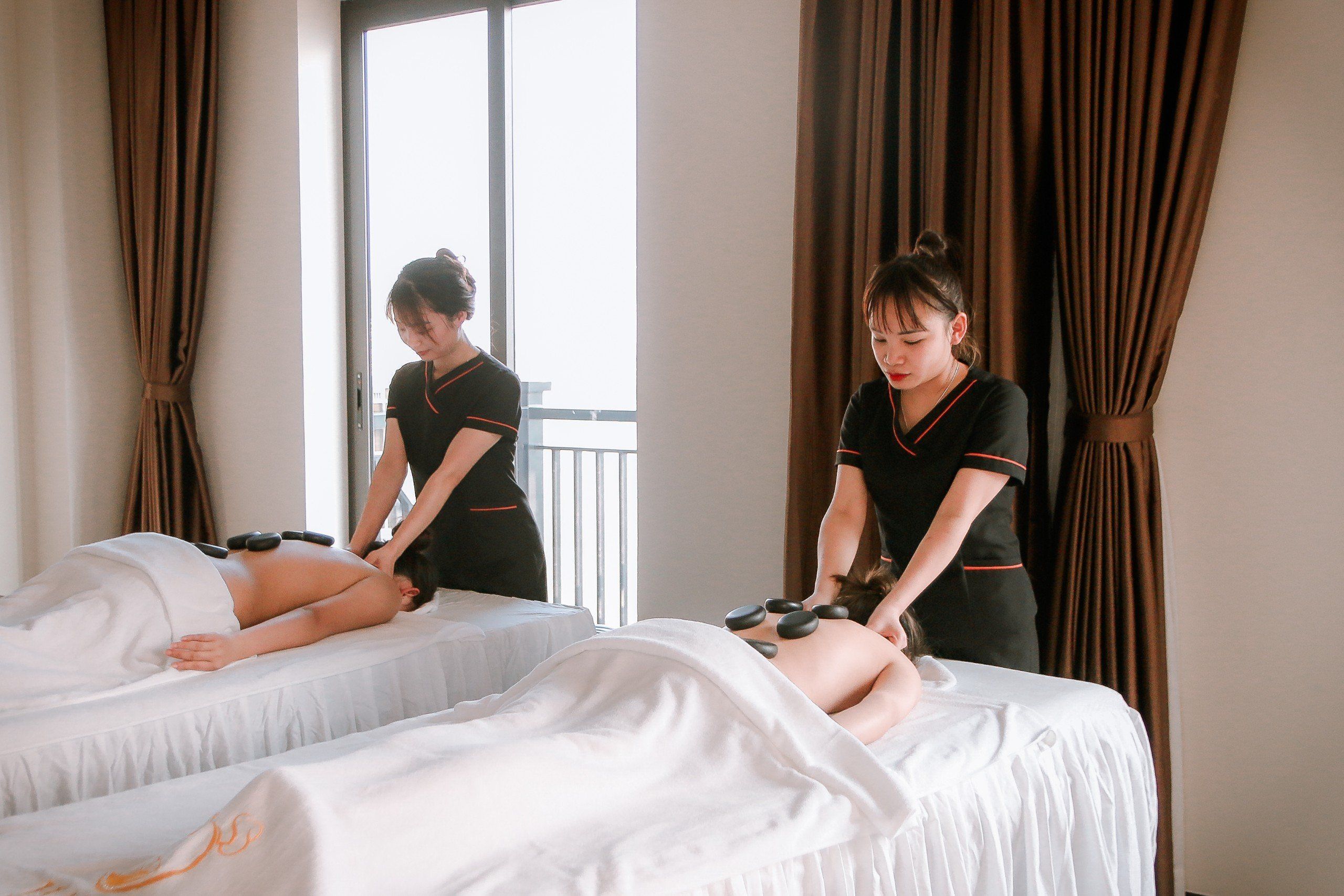 Couples hot stone massage at a resort spa